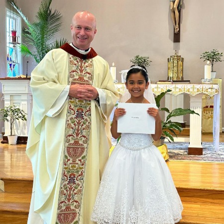 Giovanna Marie LaValle wore a beautiful outfit at her First Holy Communion.